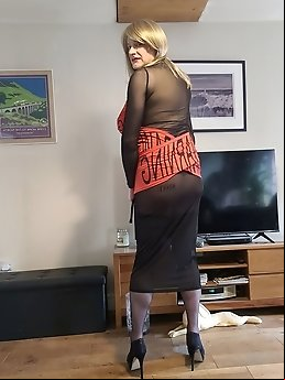 Sissy Lucy, clad in provocative lingerie, accompanied by mature English beauty Lisa
